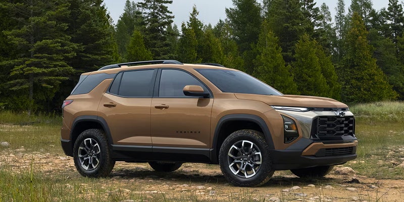 2027 Chevy Equinox with trees behind it